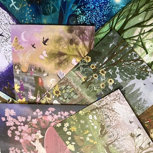 May include: A selection of art prints displaying fantastical illustrations. The prints depict scenes with trees, butterflies, birds, and figures, in a palette of greens, purples, and yellows. The artwork has a dreamy, storybook aesthetic.