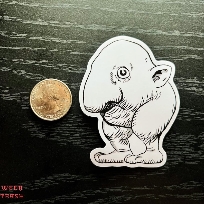 May include: Black and white line art sticker of a cartoon creature with a large nose and big eyes. The creature is standing on two legs and has a small tail.