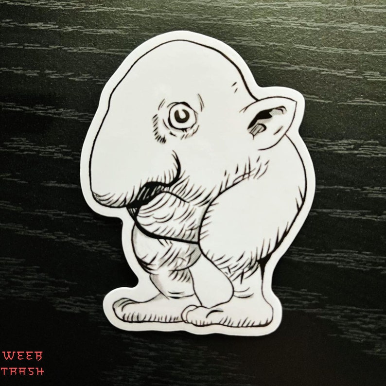 May include: Black and white line drawing of a cartoon creature with a large nose and small ears. The creature is standing on two feet and has a rounded body.