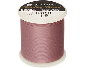 May include: A spool of pink nylon beading thread, labeled "MIYUKI Beading Thread 330dtex 100% NYLON Made in Japan LOT COL. HIO5R 18 TEL 084-972-4181"