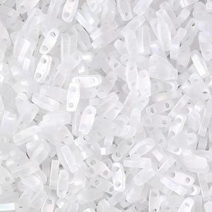 May include: A large quantity of small, white, plastic beads with two holes in each bead. The beads are shaped like a rectangle with rounded edges.
