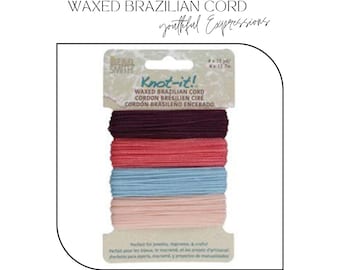 May include: Four spools of waxed Brazilian cord in shades of pink, blue, red, and purple. The cord is labeled "Knot-it!" and is perfect for jewelry making, macrame, and crafts.