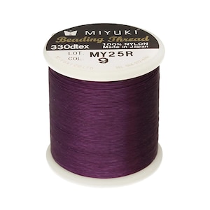 May include: A spool of purple Miyuki Beading Thread, 330dtex, 100% nylon, made in Japan. The label reads "LOT MY25R COL. 9".