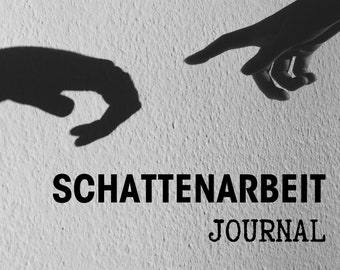 May include: Black and white photo of two hands reaching towards each other. The text "SCHATTENARBEIT JOURNAL" is printed below the hands.