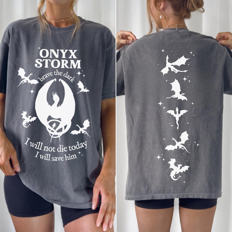 May include: A gray t-shirt with a white graphic print of a dragon and the text "ONYX STORM brave the dark I will not die today I will save him."