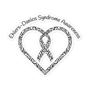 May include: Black and white zebra patterned ribbon in the shape of a heart with the text "Ehlers-Danlos Syndrome Awareness" around the top.