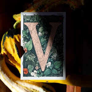 Virginia 4x6 postcard featuring the letter "V" decorated with lush green leaves and botanical details, celebrating the state's rich natural beauty. A perfect 4x6" Virginia souvenir, printed on high-quality matte cardstock for nature lovers, postcrossers, and plant enthusiasts.