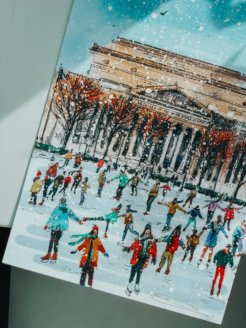 Washington DC Christmas postcard featuring a festive illustration of ice skaters at the National Gallery Sculpture Garden Ice Rink with snowy trees and holiday lights. Perfect DC holiday souvenir, Christmas greeting card, winter travel keepsake, or New Year postcard. Printed on luxe 4x6 matte cardstock, locally made in Washington DC & Virginia. Great for holiday decor lovers, DC travelers, and postcard collectors.