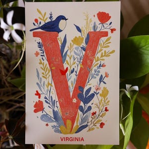 Virginia postcard featuring the letter "V" decorated with delicate floral patterns and charming birds. A 4x6" nature-inspired Virginia souvenir, printed on premium matte cardstock, celebrating the state's natural beauty and wildlife.