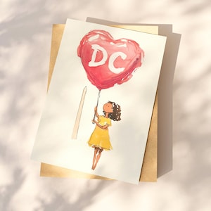 Watercolor illustration of a girl holding a red heart-shaped balloon with "DC" written on it, standing near The Washington Monument. The charming postcard captures the spirit of Washington, DC, with a dreamy, whimsical touch. Perfect for DC lovers, travel enthusiasts, and postcard collectors, this 4x6 design makes a unique souvenir or gift. Printed on premium cardstock with a matte finish, it’s ideal for mailing, framing, or adding to your collection.