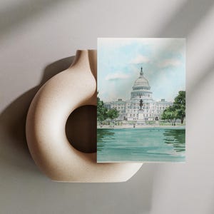 Hand-drawn Washington DC postcard featuring watercolor illustration with the US Capitol Building. Elegant 4x6 postcard with watercolor-style artwork, perfect for Washington DC tourists, DC locals, collectors, post crossers, and travel souvenirs collectors.