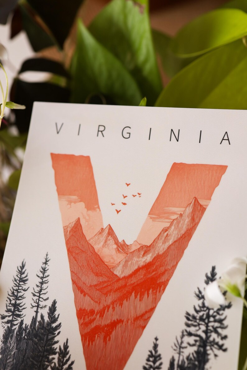 Virginia postcard featuring the letter "V" artistically intertwined with lush forests and majestic mountain peaks. A perfect 4x6" Virginia souvenir celebrating the state’s natural beauty. Printed on premium matte cardstock, ideal for nature lovers, hikers, and adventure seekers.