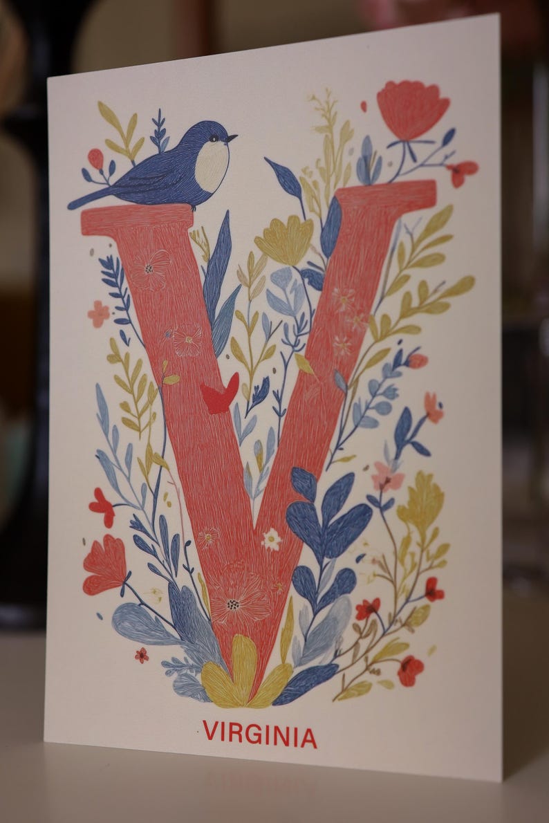 Virginia postcard featuring the letter "V" decorated with delicate floral patterns and charming birds. A 4x6" nature-inspired Virginia souvenir, printed on premium matte cardstock, celebrating the state's natural beauty and wildlife.