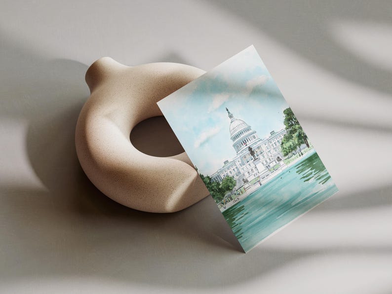 Hand-drawn Washington DC postcard featuring watercolor illustration with the US Capitol Building. Elegant 4x6 postcard with watercolor-style artwork, perfect for Washington DC tourists, DC locals, collectors, post crossers, and travel souvenirs collectors.