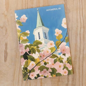 Watercolor illustration of cherry blossom trees in Old Town Alexandria, Virginia. A charming spring scene with soft pink blooms, historic streets, and a touch of whimsy. Perfect for DC Metro area souvenirs and floral art lovers.