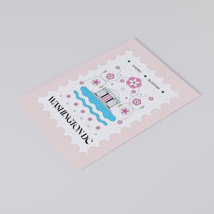Washington DC cherry blossom postcard featuring a postage stamp design with the Jefferson Memorial and Tidal Basin in peak bloom. A perfect Washington DC souvenir, travel keepsake, and unique postcard for cherry blossom lovers, Washington DC tourists, and postcrossers.