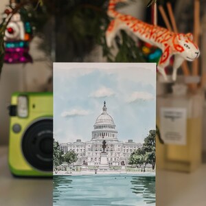 Hand-drawn Washington DC postcard featuring the US Capitol Building. Elegant 4x6 postcard with watercolor-style artwork, perfect for collectors, postcrossing, and travel souvenirs.