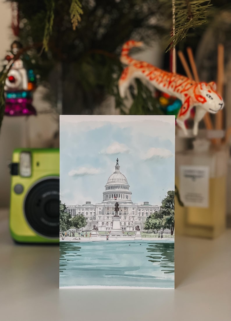 Hand-drawn Washington DC postcard featuring the US Capitol Building. Elegant 4x6 postcard with watercolor-style artwork, perfect for collectors, postcrossing, and travel souvenirs.
