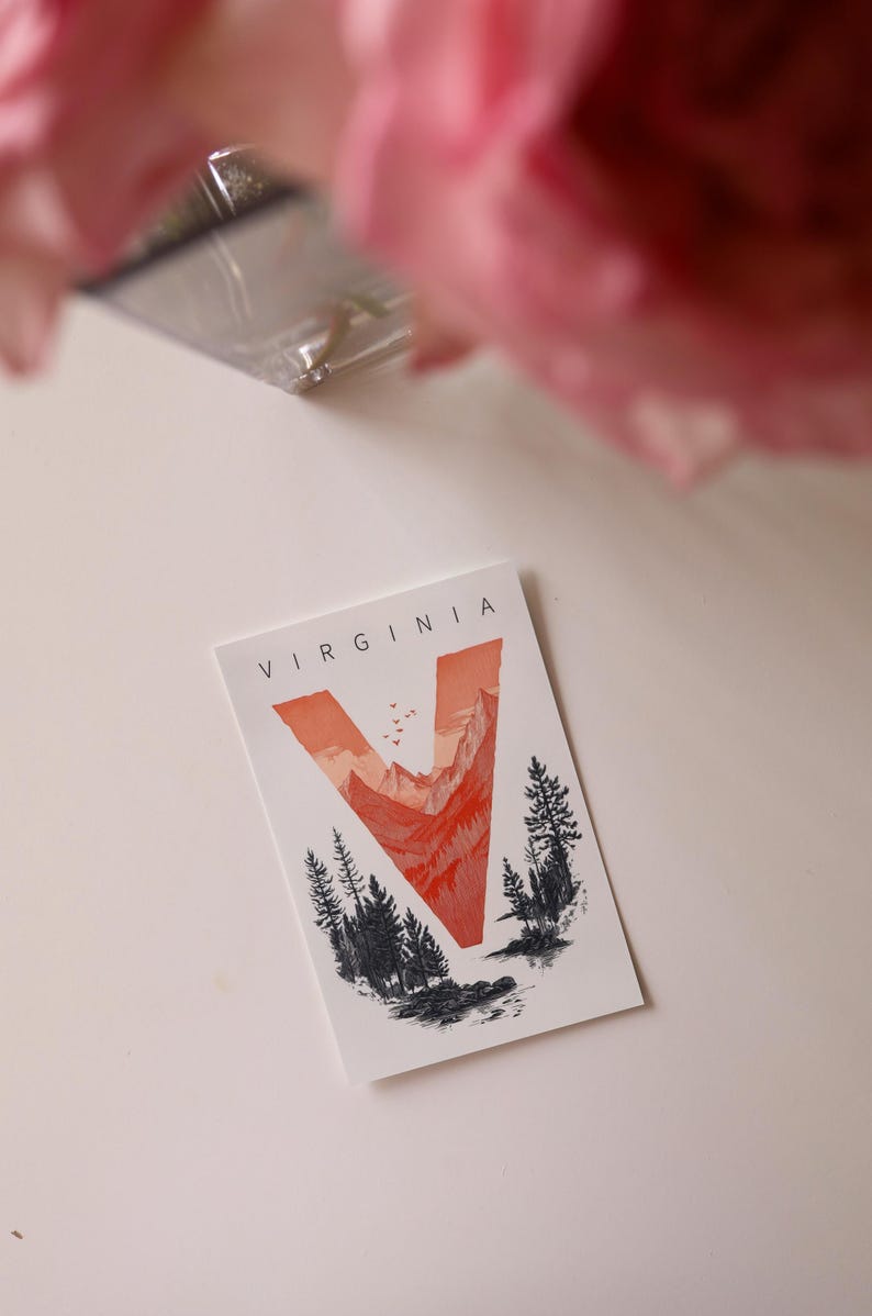 Virginia postcard featuring the letter "V" artistically intertwined with lush forests and majestic mountain peaks. A perfect 4x6" Virginia souvenir celebrating the state’s natural beauty. Printed on premium matte cardstock, ideal for nature lovers, hikers, and adventure seekers.