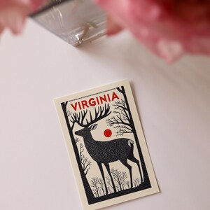 Virginia postcard featuring a graceful deer in the wilderness of Shenandoah National Park. A charming 4x6" Virginia souvenir for nature lovers, wildlife enthusiasts, and those who adore the beauty of the great outdoors. Printed on premium matte cardstock for a timeless touch.