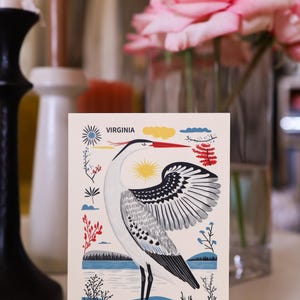 Virginia postcard featuring a majestic heron, the state’s graceful water bird, standing by the water’s edge. A perfect 4x6" Virginia souvenir for nature lovers, posrcrossers, snail mail lovers, bird watchers, and wildlife enthusiasts. Printed on premium matte cardstock, capturing the serene beauty of Virginia’s waterways. Wonderful watercolor postcard for mailing.