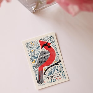 Virginia postcard featuring a state symbol — red cardinal bird. A perfect 4x6" Virginia souvenir for nature lovers, posrcrossers, snail mail lovers, bird watchers, and wildlife enthusiasts. Printed on premium matte cardstock, capturing the serene beauty of Virginia’s waterways. Wonderful watercolor postcard for mailing.