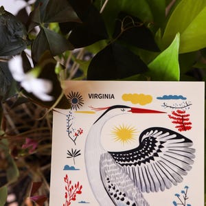 Virginia postcard featuring a majestic heron, the state’s graceful water bird, standing by the water’s edge. A perfect 4x6" Virginia souvenir for nature lovers, posrcrossers, snail mail lovers, bird watchers, and wildlife enthusiasts. Printed on premium matte cardstock, capturing the serene beauty of Virginia’s waterways. Wonderful watercolor postcard for mailing.
