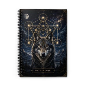 May include: A spiral-bound notebook featuring a dark, nocturnal landscape with a central wolf portrait. Above the wolf, a glowing gold geometric pattern overlays a starry sky with a moon. The word NOTEBOOK is printed in gold at the bottom.