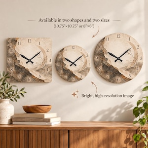May include: Three wall clocks featuring a beige and dark gray abstract landscape design with black hands and numerals. The text reads: Available in two shapes and two sizes (10.75"x10.75" or 8"x8") and Bright, high-resolution image.