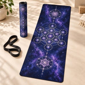 May include: A rectangular yoga mat and a matching rolled yoga mat featuring a deep purple and blue galaxy print with white geometric Metatron's cube and lotus flower patterns. A black adjustable carrying strap is included.