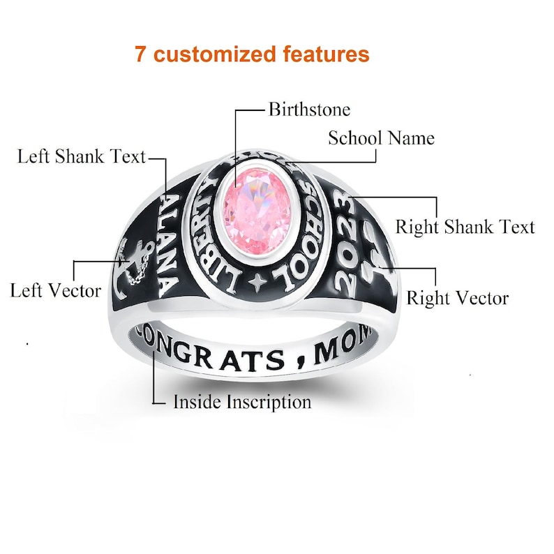 May include: A silver class ring with black lettering. The ring features a pink birthstone, the words "ALANA LIBERTY SCHOOL 2023", and the inscription "CONGRATS, MOM".