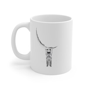 The Hanging Astronaut Coffee Mug 11oz