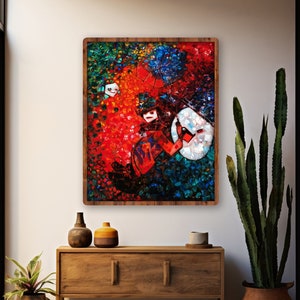 May include: A colorful abstract painting with a person playing a guitar in the center. The painting is framed in a dark wood frame and is hanging on a white wall above a wooden console table.