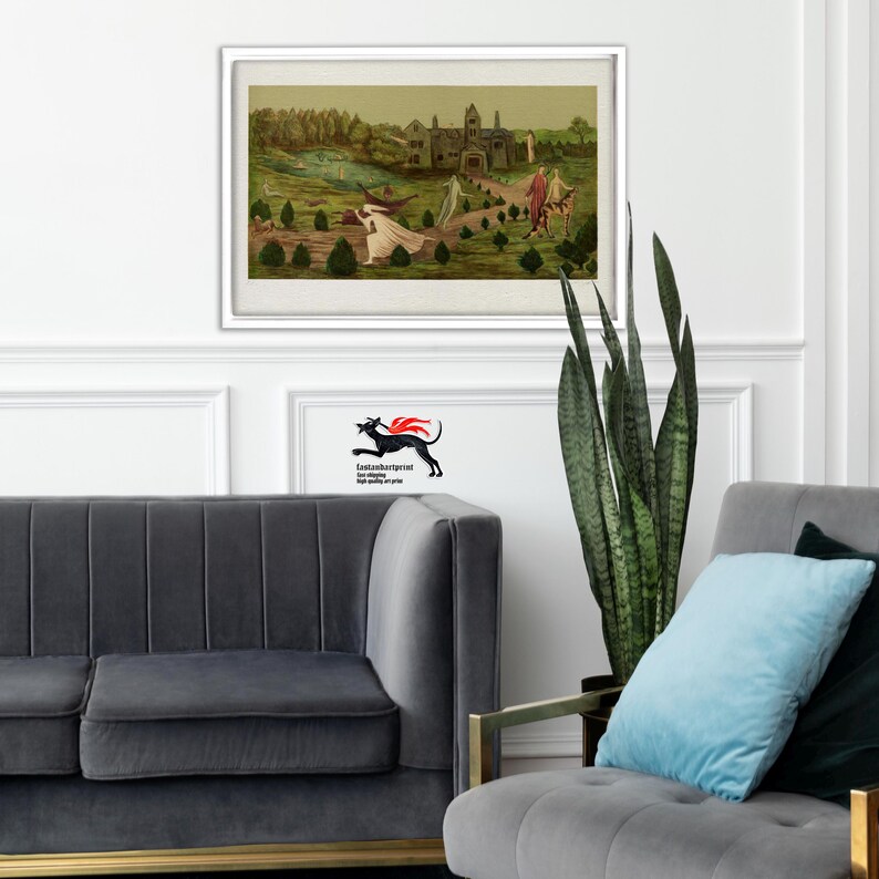 May include: A framed horizontal art print featuring a landscape with a large stone building, green trees, and several figures in flowing white robes walking along a path. The print is displayed in a white frame on a white wall above a gray sofa.