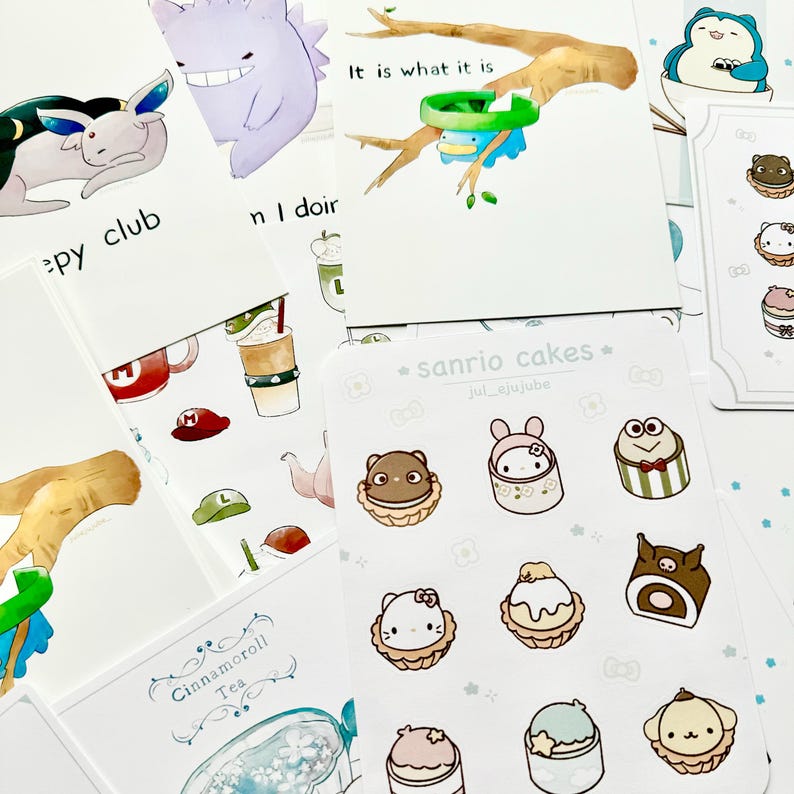 May include: A sheet of stickers featuring various Sanrio characters, including Hello Kitty, Cinnamoroll, and My Melody. Each sticker depicts a character enjoying a slice of cake. The stickers are printed on a white background with a light blue border.