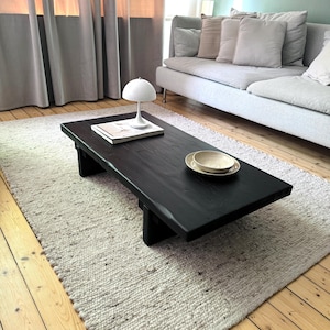 Coffee table made of black oiled reclaimed wood | Lowboard | Sideboard in Yakisugi style | Black coffee table | Coffee table made of scaffolding planks | Yoga bench |