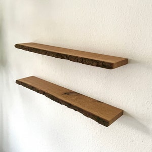 Floating wall shelf made of oiled oak with bark and tree edge | floating shelf