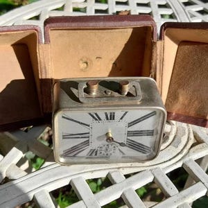 Antique art deco travel clock and case