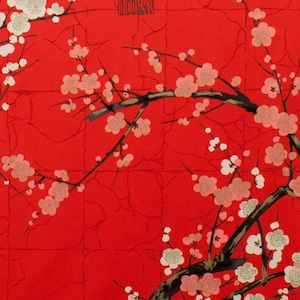 May include: Red fabric with a repeating pattern of black branches with pink and white blossoms. The Chinese character "春" (spring) is printed in black on the fabric.