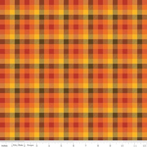 May include: A plaid fabric with a repeating pattern of orange, yellow, brown, and green squares. The fabric is measured in inches.