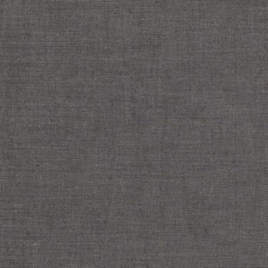 May include: A close-up of a dark gray fabric with a subtle woven texture.
