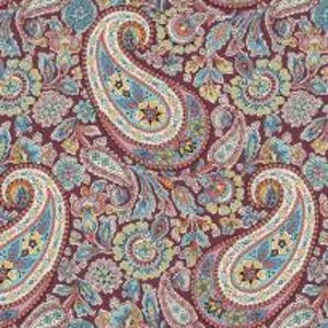 May include: A paisley print fabric with a maroon background and a variety of colors including blue, pink, yellow, and green. The fabric features a repeating pattern of paisley shapes.