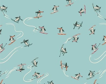 May include: A repeating pattern on a light blue background features cartoon penguins skiing down white wavy lines. The penguins are wearing hats and scarves, and are on skis in various colors. The design is whimsical and playful.