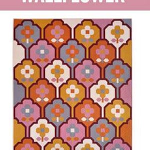 May include: A quilt pattern called "Wallflower" with a geometric design featuring a repeating pattern of orange, pink, yellow, white, and gray flowers. The pattern is labeled as a "Large Throw" and is described as a "Traditionally pieced quilt pattern for the intermediate sewist and up."
