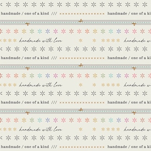 May include: A beige background with a repeating pattern of gray stars and a light blue line. The text "handmade/ one of a kind ///" and "handmade with love" is repeated throughout the image.