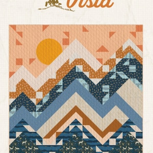 May include: A quilt pattern depicting a mountain landscape with a sun, a blue sky, and brown and white mountains. The quilt is made from various fabrics with geometric patterns. The title "Scenic Vista" is written in a decorative font above the quilt.