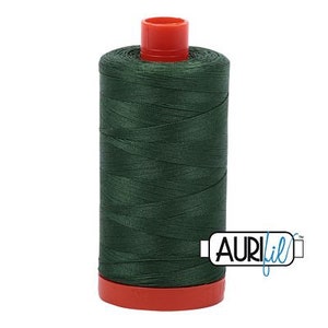 May include: A spool of dark green thread with a red plastic bobbin and the word "Aurifil" printed on the side.
