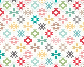 May include: A white fabric with a repeating pattern of colorful patchwork squares. Each square features a different geometric design, including stars, diamonds, and squares. The fabric is perfect for quilting, crafting, and other sewing projects.
