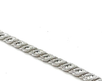 Bracelet tennis en or blanc 14 carats serti de diamants