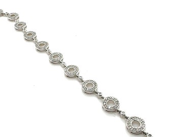 Bracelet tennis à cercle ouvert et diamants en or blanc 14 carats